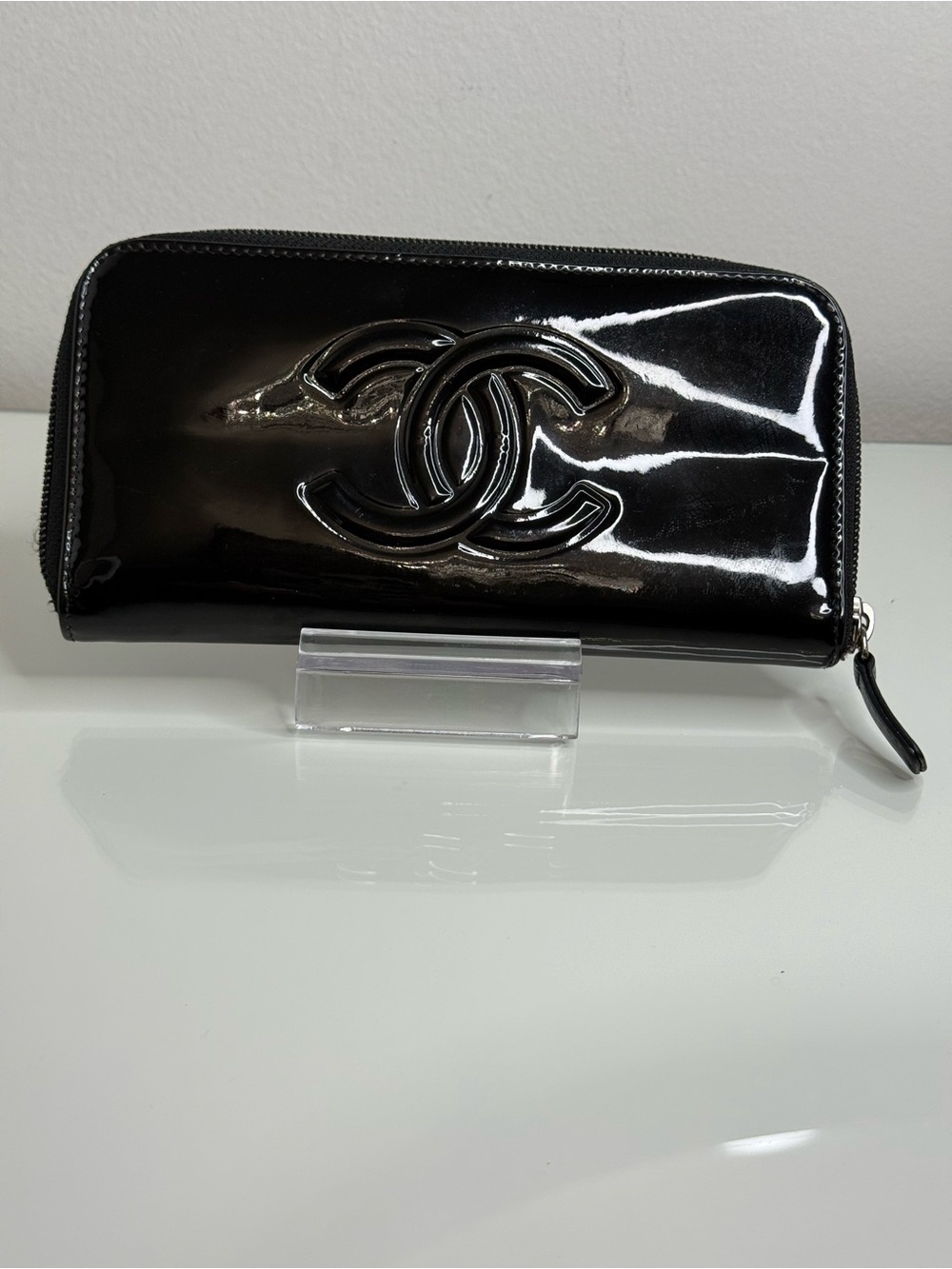 CHANEL Black Patent Leather Zip-Around Wallet with Raised CC Emblem